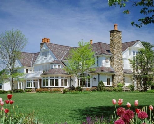 Backview of New England manor in cedar and stone