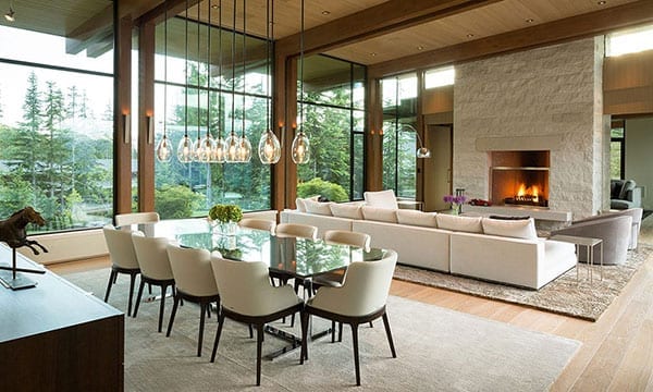 Modern dining room with large wood windows in the background