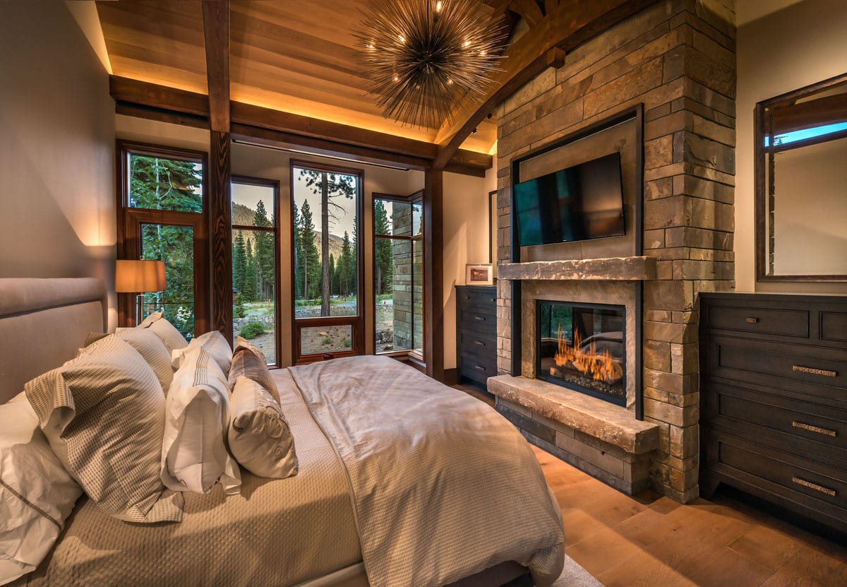 Bedroom with view through custom modern wood windows